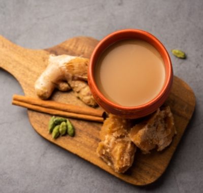 Jaggery tea or Gur ki chai with ingredients like gud, ginger or adrak, green cardamom and cinnamon